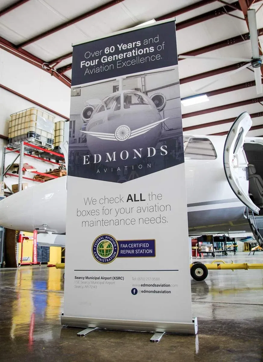 The Edmonds Aviation retractable banner in the hangar