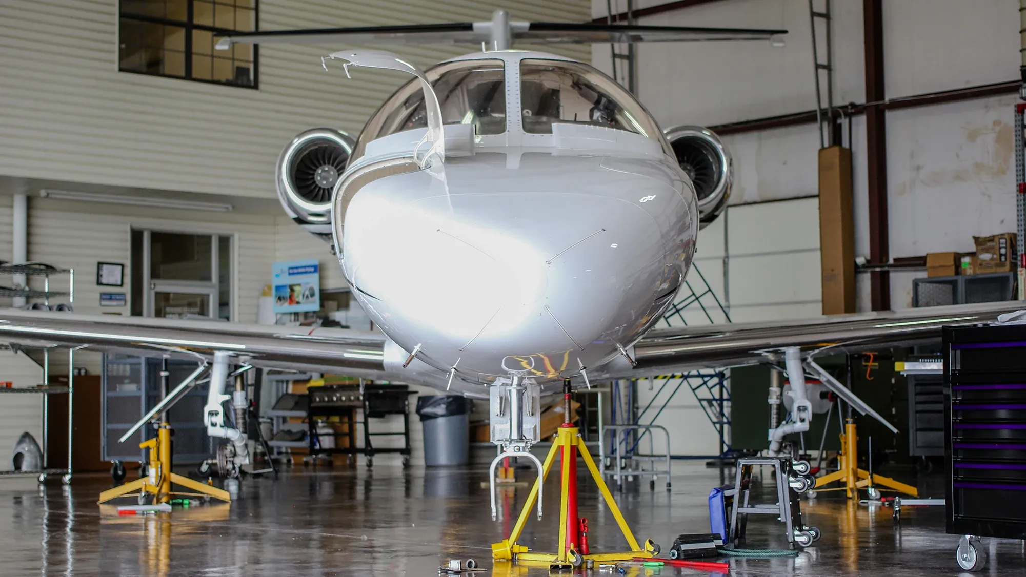 A business jet in the Edmonds Aviation hangar, nose on