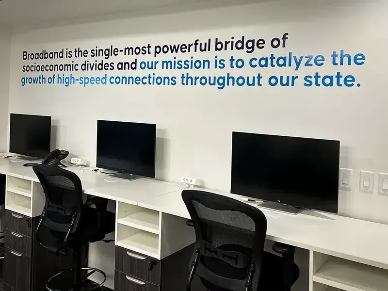 Wall vinyl carrying the mission statement in the DSN office