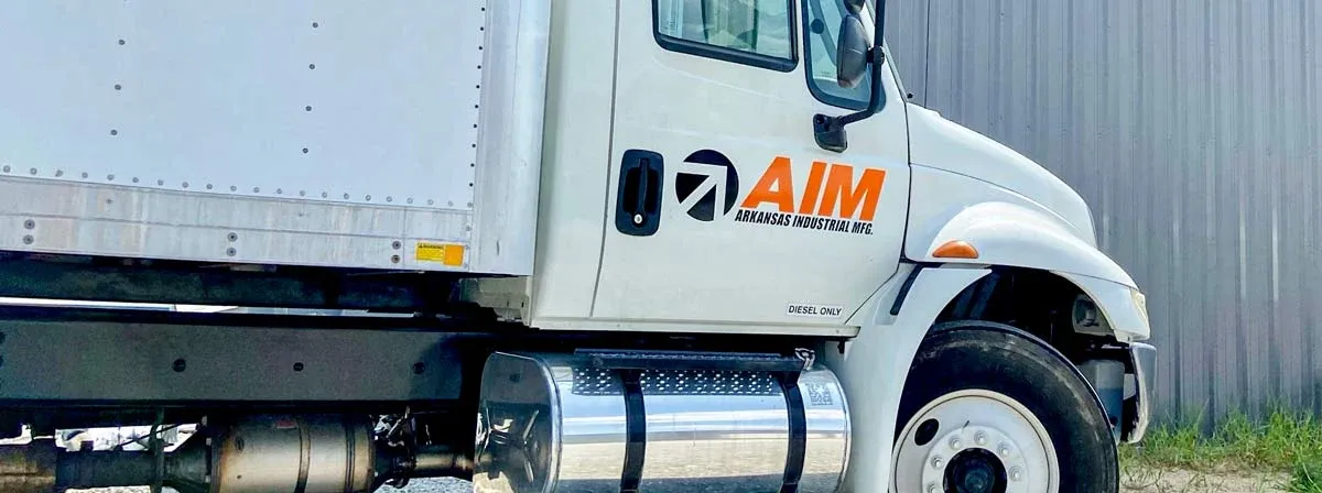 The AIM logo applied to a delivery truck