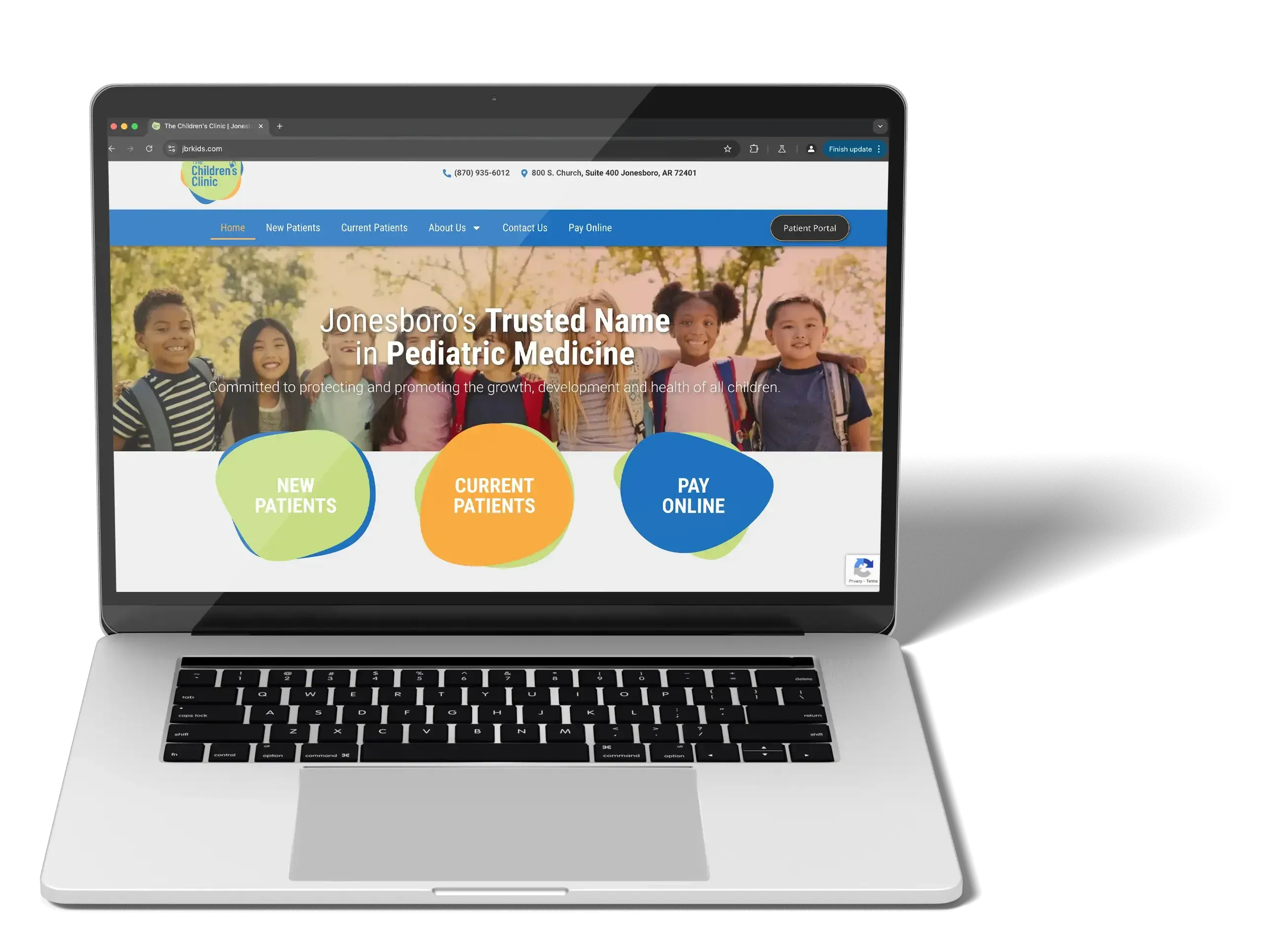 The Children's Clinic website on a laptop
